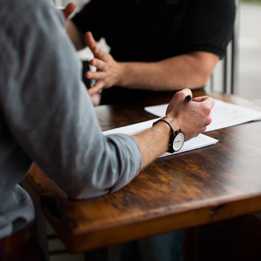 image showing two men communicating